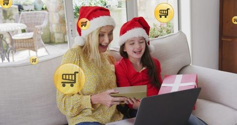 Joyful mother and daughter online christmas shopping