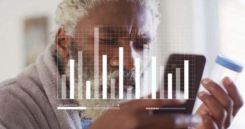 Senior man checking medicine instructions with smartphone graph