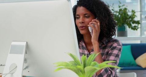 Focused Professional Multitasking on Computer and Phone Call - Download Free Stock Images Pikwizard.com