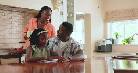 Happy Family Supporting Daughter's Learning at Home