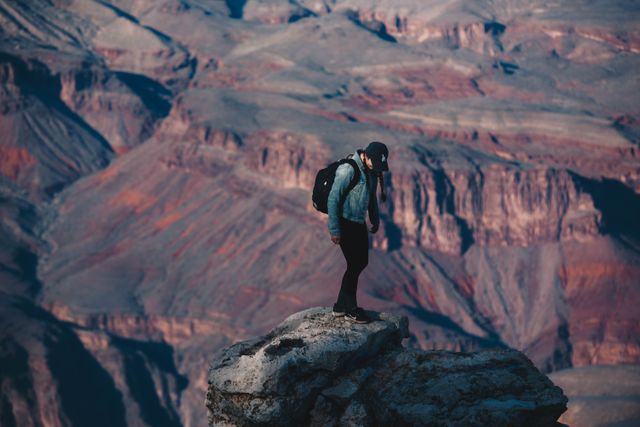 Solo Traveler Exploring Grand Canyon Cliffs - Download Free Stock Images Pikwizard.com