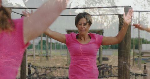 Woman in pink engaged in outdoor fitness workout