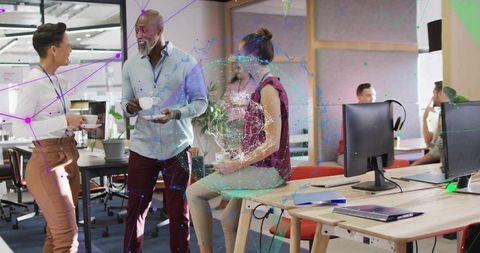 Diverse team collaboration with technological network overlay in office