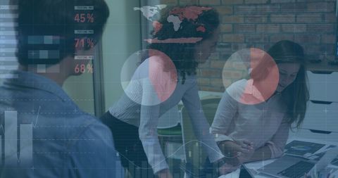 Diverse team analyzing financial and global data on digital interface