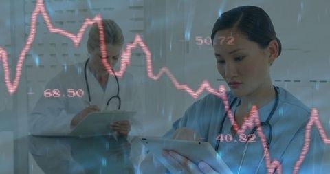 Medical Professionals Using Technology for Diagnostics with Data Overlay