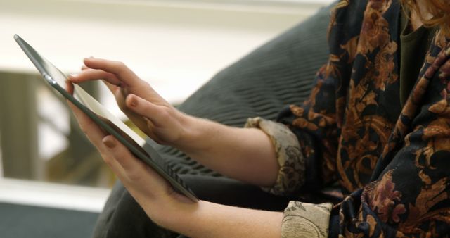 Hands Using Tablet Close-Up, Person Reclining on Sofa Subdued Background - Download Free Stock Images Pikwizard.com