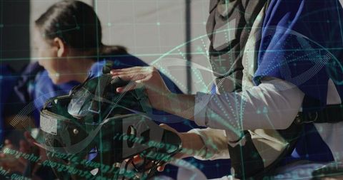 Woman Examining VR Headset with DNA Overlaid Imagery