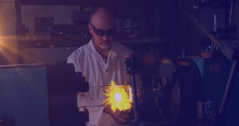 Worker In Manufacturing Process with Glowing Light - Download Free Stock Images Pikwizard.com