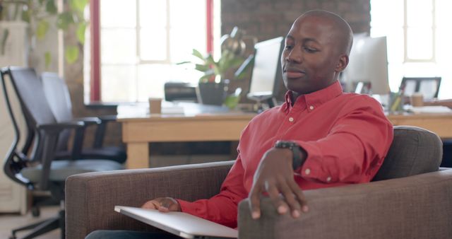 Professional Man Relaxing in Office Lounge Area - Download Free Stock Images Pikwizard.com