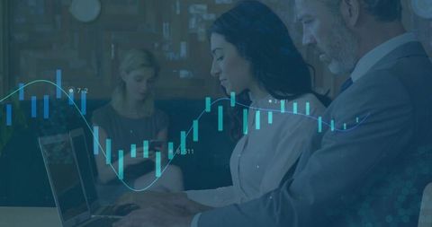 Business professionals analyzing financial data on laptop with candlestick chart overlay
