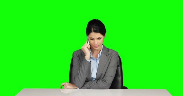 Businesswoman Having Phone Call at Desk with Green Screen Background - Download Free Stock Images Pikwizard.com