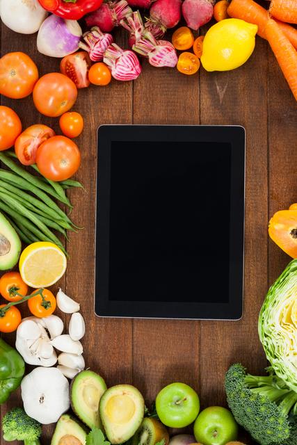Digital Tablet Surrounded by Fresh Vegetables and Fruits - Download Free Stock Photos Pikwizard.com