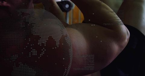 Flexing male bodybuilder showing bicep and torso with digital globe and code overlays