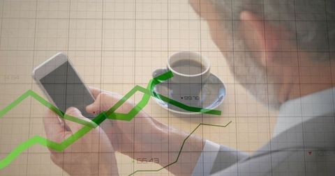 Business Executive Analyzing Market Trends on Smartphone with Coffee at Desk