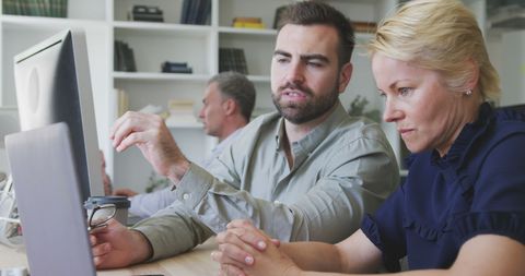 Colleagues Collaborating on Project in Modern Office - Download Free Stock Images Pikwizard.com