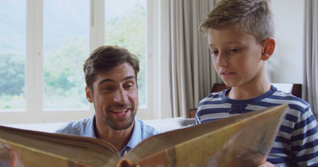 Father Reading Book with Son at Home - Download Free Stock Images Pikwizard.com