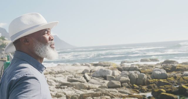 Senior Man with White Beard and Hat Enjoying Seaside View - Download Free Stock Images Pikwizard.com