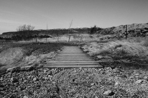 Rural wooden footpath in idyllic countryside landscape