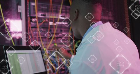 IT Engineer Managing Server with GPU Data Overlay Symbolizing 5G Networks - Download Free Stock Images Pikwizard.com