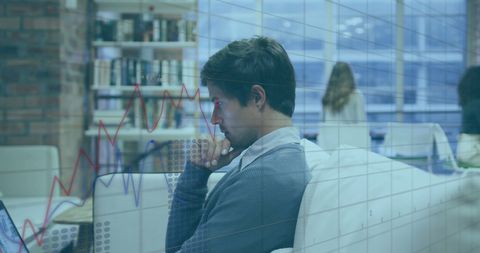 Businessman Processing Financial Data in Modern Office