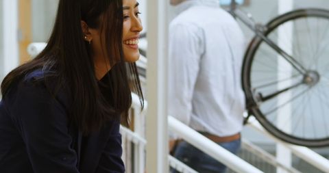 Cheerful Woman Smiling Inside Home Office with Leisurely Vibe