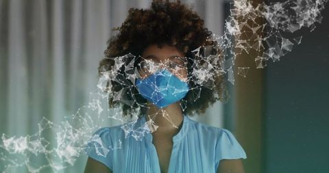 Woman wearing blue medical mask and glasses with particle network overlay visualization