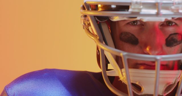 American Football Player Wearing Helmet and Eye Black Ready for Game - Download Free Stock Images Pikwizard.com