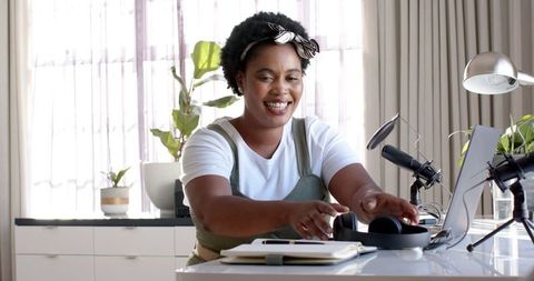 African American Woman Recording Podcast in Bright Home Office