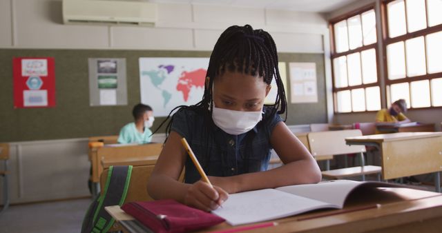 Young Girl Wearing Face Mask Studying in Classroom - Download Free Stock Images Pikwizard.com