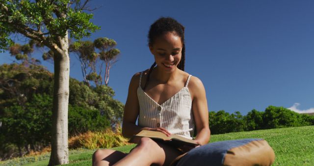 Young Woman Enjoying Summer Reading Outdoors - Download Free Stock Images Pikwizard.com