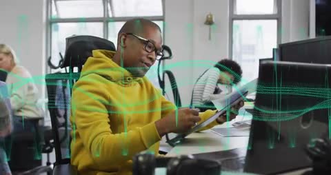 Office Worker Reviewing Notes with Data Visualization Overlay