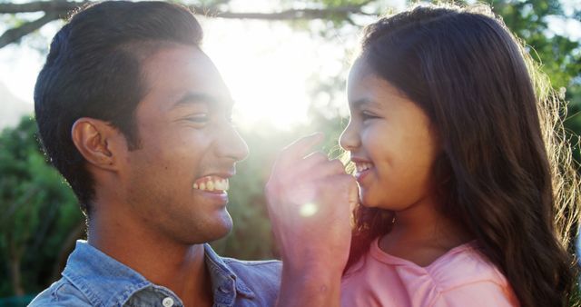 Laughing Father and Daughter Bonding Outdoors at Sunset - Download Free Stock Images Pikwizard.com