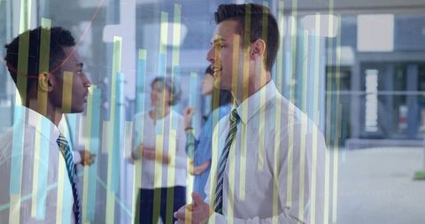 Two Business Professionals Analyzing Financial Chart Overlay in Modern Office