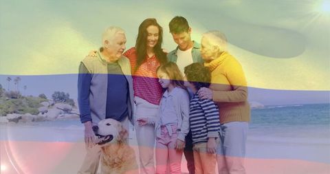 Multigenerational family enjoying beach day with golden retriever and sunlight stripes