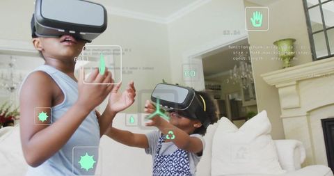 Siblings immersed in virtual reality adventure at home