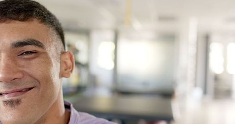 Smiling man in rehabilitation center lightheartedly expresses joy and progress