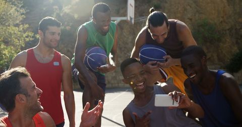 Diverse Basketball Players Taking Selfie Outdoors