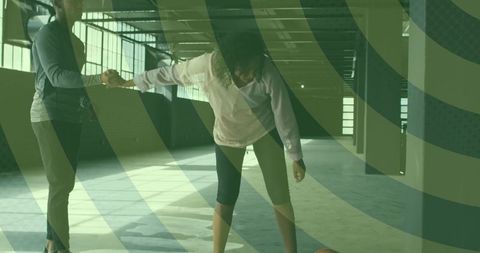 Mentor Offering Support to African American Woman in Fitness Environment