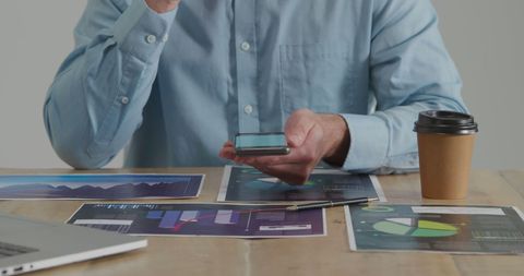 Businessman Analyzing Graphs and Data Reports with Smartphone - Download Free Stock Images Pikwizard.com