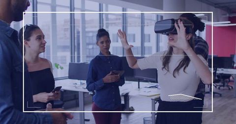 Young Professionals Experimenting with Virtual Reality in Modern Office
