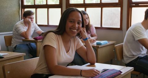 Smiling Teen Girl Relaxed in Classroom Environment