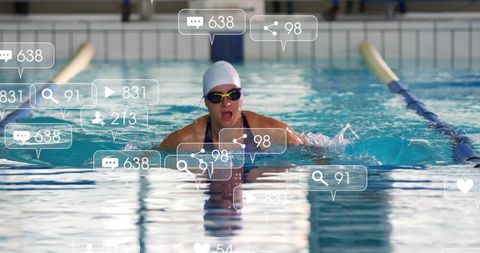 Competitive swimmer swimming breaststroke in indoor pool with social media overlay icons