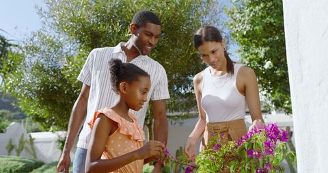 Diverse Family Enjoying Outdoor Garden Activity Together