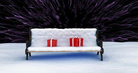 Christmas presents in snowy bench with fireworks display