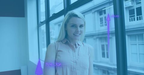 Businesswoman in Office Embracing Technology with Growth Indicators