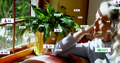 Older Woman Reflecting on Social Media Activity at Home