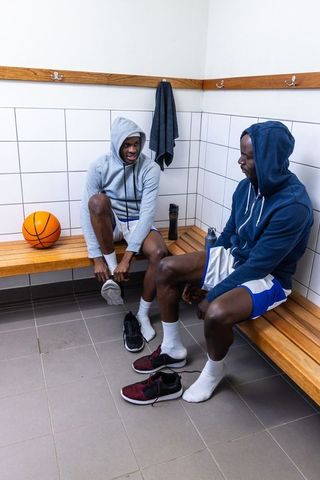 Athletes Preparing in Locker Room with Basketball Enthusiasm