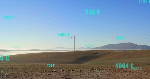 Spinning wind turbine on ridge with ar data overlays over rolling fields and low fog