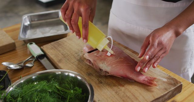 Preparing Fresh Fish with Olive Oil for Cooking - Download Free Stock Images Pikwizard.com