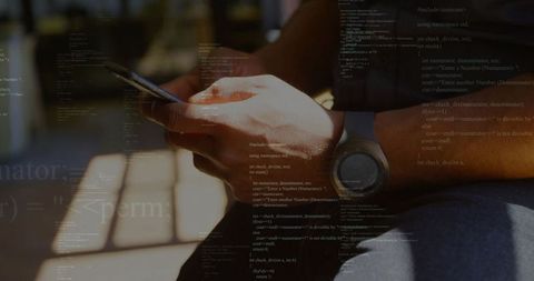 Person typing on smartphone with code overlay in sunlight